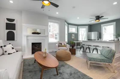 a living room with a couch and a fireplace at Deluxe 4-Bedroom w Huge Deck 3-Min to Downtown in Cincinnati