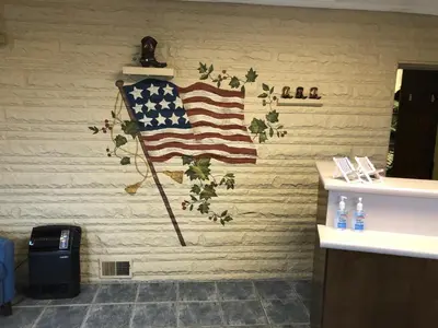 a bathroom with an american flag on the wall at Motel Boutique by Wolf Inn in Milan