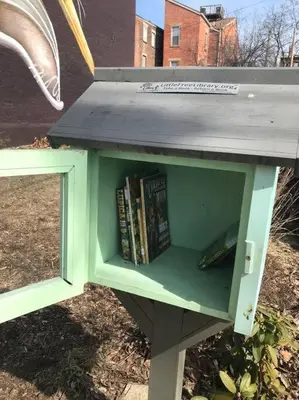 a green book shelf with books on it at CUTE & COZY/TQL stadium/ Findlay Market/Brewery in Cincinnati