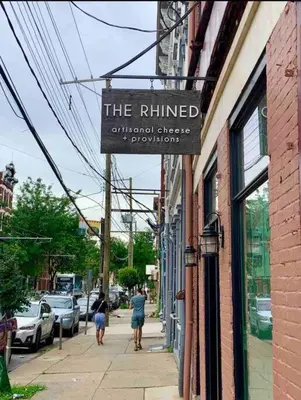 a sign for the ruined orthodontic shop on a building at CUTE & COZY/TQL stadium/ Findlay Market/Brewery in Cincinnati