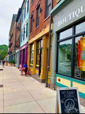 a city street with a sign in front of a store at CUTE & COZY/TQL stadium/ Findlay Market/Brewery in Cincinnati