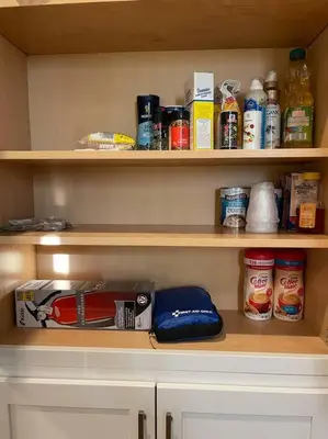 a pantry with wooden shelves filled with food at Modern/ parking/Eden Park/near Downtown/ FCC in Cincinnati