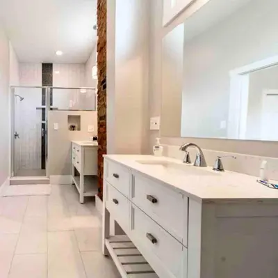a white bathroom with a sink and a mirror at Modern/ parking/Eden Park/near Downtown/ FCC in Cincinnati