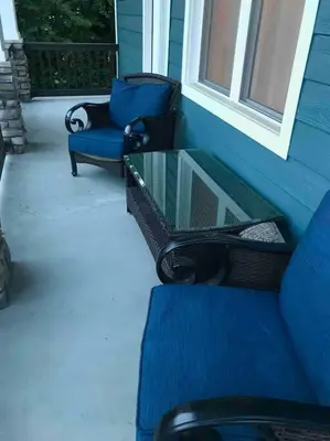 a patio with a glass table and chairs on a porch at Modern/ parking/Eden Park/near Downtown/ FCC in Cincinnati