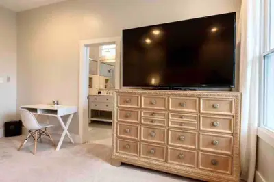 a large entertainment center with a large television on top of it at Modern/ parking/Eden Park/near Downtown/ FCC in Cincinnati