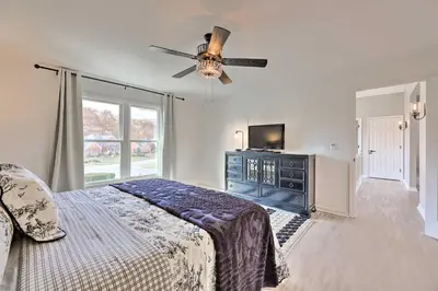 a bedroom with a bed and a ceiling fan at Luxury Maineville Villa with Private Pool and Deck in Maineville