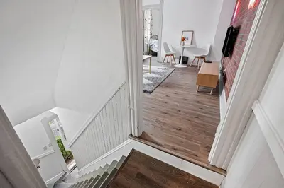 a view of a hallway with a stairway at Center of Little Italy #4 in Cleveland