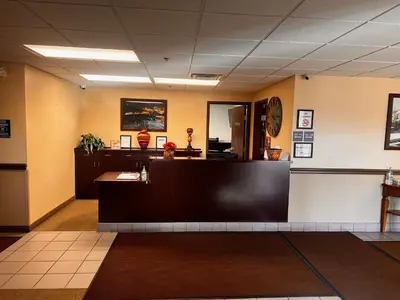 a waiting room with a reception desk in a lobby at Ambridge Inn in Ambridge