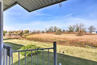 a view of a field from the porch of a house at Quaint Couples Escape Pool, Near Lake Erie! in Oak Harbor