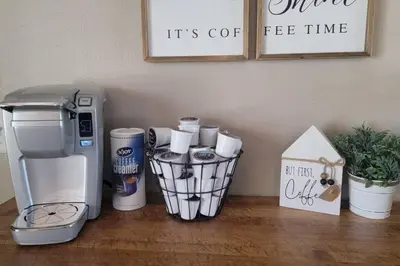 a coffeemaker and a coffee maker sitting on a table at 6418 Sandric lane Beautiful 3 BDRM Ranch home in Liberty Township in Jericho