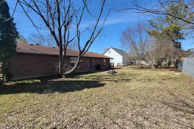 a yard with a house and a tree at 6418 Sandric lane Beautiful 3 BDRM Ranch home in Liberty Township in Jericho