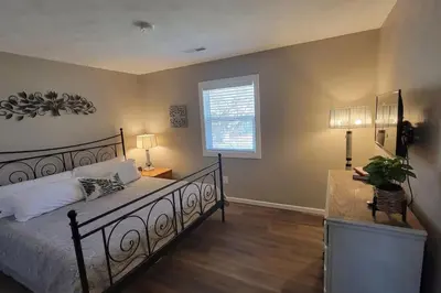 a bedroom with a bed and a desk and a window at 6418 Sandric lane Beautiful 3 BDRM Ranch home in Liberty Township in Jericho