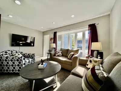 a living room with a couch and a table at 7086 Tylersville Beautiful 4 BDR Home - Near I-75 in Maud