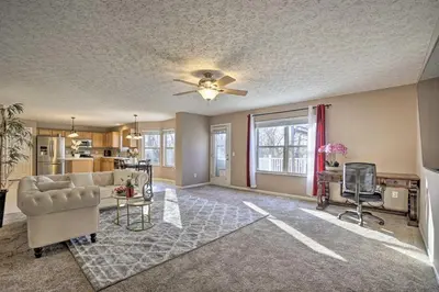 a living room with a couch and a ceiling fan at Spacious Delaware Abode with Private Backyard! in Delaware