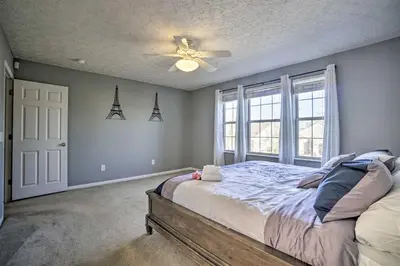 a bedroom with a bed and a ceiling fan at Spacious Delaware Abode with Private Backyard! in Delaware