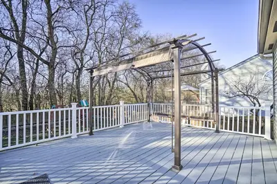 a pergola on a deck with a fence at Spacious Delaware Abode with Private Backyard! in Delaware