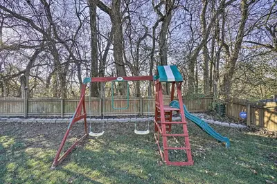 a playground with a slide in a yard at Spacious Delaware Abode with Private Backyard! in Delaware