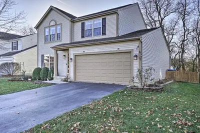 a large house with a garage in the yard at Spacious Delaware Abode with Private Backyard! in Delaware