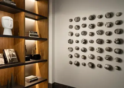 a wall with a bunch of skulls on a wall at AC Hotel by Marriott Dayton in Dayton