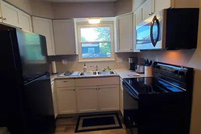 a small kitchen with a sink and a refrigerator at 219 Maxwell St Unit B Such a great place to work and stay in Franklin