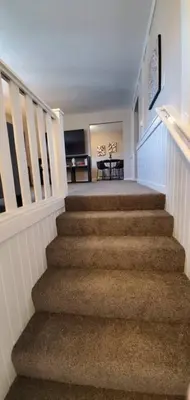 a staircase in a house with a table in the background at 219 Maxwell St Unit B Such a great place to work and stay in Franklin