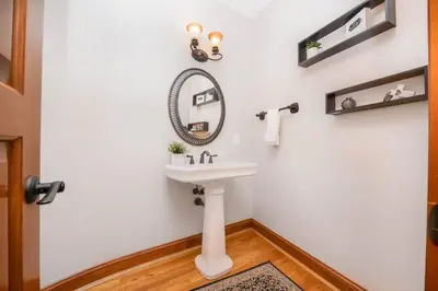 a bathroom with a sink and a mirror on the wall at 5755 Butler Warren Cheerful 6-Bedroom Villa with fishing pond in Jericho