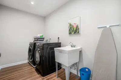 a laundry room with a washing machine and a sink at 1392 Soaring Way Brand new construction in well-kept HOA community in Maineville