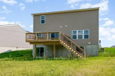 a house with a deck on the side of it at 1392 Soaring Way Brand new construction in well-kept HOA community in Maineville