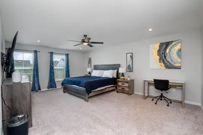 a bedroom with a bed and a ceiling fan at 1392 Soaring Way Brand new construction in well-kept HOA community in Maineville