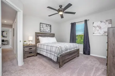 a bedroom with a bed and a ceiling fan at 1392 Soaring Way Brand new construction in well-kept HOA community in Maineville
