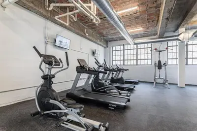 a gym with several treadmills and exercise bikes at 5103 Peters New Industrial Loft on Lebanon Bike Trail in Maineville