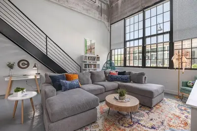 a living room with a couch and a table at 5103 Peters New Industrial Loft on Lebanon Bike Trail in Maineville