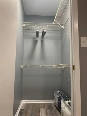 a walk in closet with gray walls and shelves at 5145 Porsche Newly Remodeled 2 BDRM Ranch Attached Home in Rockdale