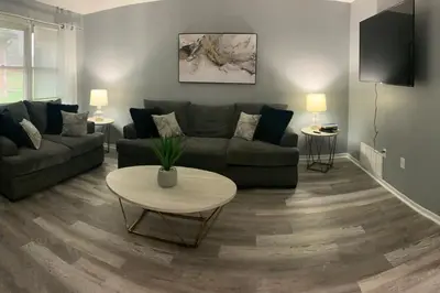 a living room with a couch and a table at 5145 Porsche Newly Remodeled 2 BDRM Ranch Attached Home in Rockdale