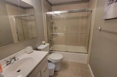 a bathroom with a toilet and a sink and a shower at 1349 Jennings court Private Pool, Fire pit, BBQ A FUN place to RELAX in Mason