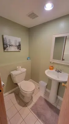 a bathroom with a toilet and a sink at 1349 Jennings court Private Pool, Fire pit, BBQ A FUN place to RELAX in Mason