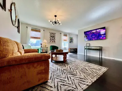 a living room with a couch and a table at 190 Overbrook Drive Swanky Swangos Dream Home by Jess in Monroe