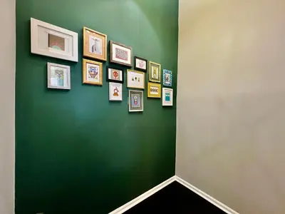 a green wall with a bunch of pictures on it at 190 Overbrook Drive Swanky Swangos Dream Home by Jess in Monroe