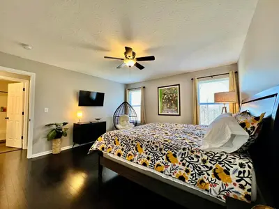 a bedroom with a bed and a ceiling fan at 190 Overbrook Drive Swanky Swangos Dream Home by Jess in Monroe