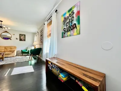 a living room with a book shelf on the wall at 190 Overbrook Drive Swanky Swangos Dream Home by Jess in Monroe