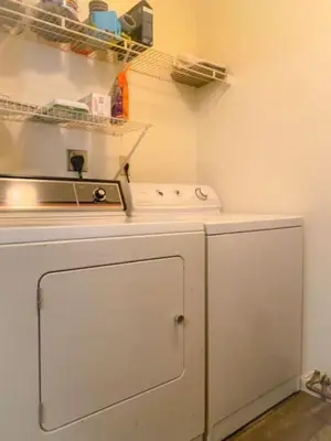 a kitchen with a stove and a white refrigerator at 240 Overbrook NEW Franks funky and fashionable furnished home in Monroe