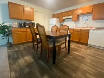 a kitchen with a table and chairs in a room at 240 Overbrook NEW Franks funky and fashionable furnished home in Monroe