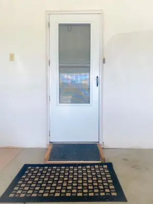a white door with a black mat in front of it at 240 Overbrook NEW Franks funky and fashionable furnished home in Monroe