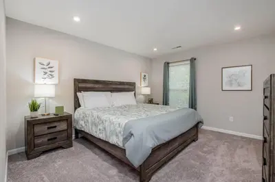 a bedroom with a large bed and a window at 950 Southline Newly Built Home in Lebanon 4 BDR 2 5 Bath in Lebanon