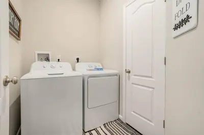 a white laundry room with a washer and dryer at 950 Southline Newly Built Home in Lebanon 4 BDR 2 5 Bath in Lebanon