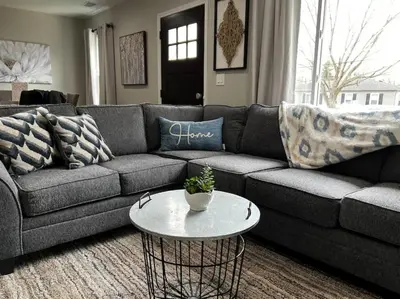 a living room with a couch and a table at 956 Olympia Drive Brand New Mason Home with Luxurious Finishes in Mason