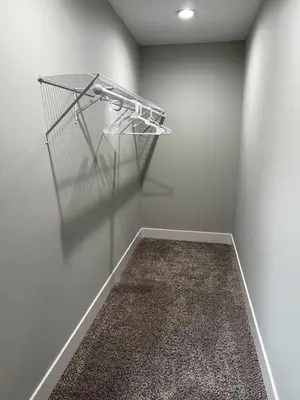 a empty room with a shelf on the wall at 956 Olympia Drive Brand New Mason Home with Luxurious Finishes in Mason
