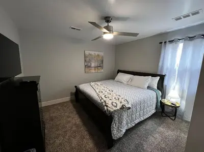 a bedroom with a bed and a ceiling fan at 956 Olympia Drive Brand New Mason Home with Luxurious Finishes in Mason