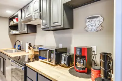 a kitchen with a counter top with appliances on it at Cozy Newport Cottage Near Stadiums and Downtown in Newport