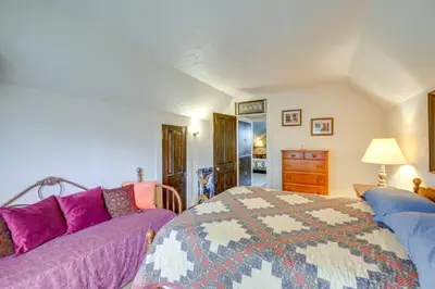 a bedroom with a bed and a couch at Historic Alexandria Home with Private Yard! in Alexandria